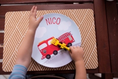 Documentary family photographer photographed boy waiting to eat from customized name dinner plate