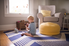 Documentary family photograph of a boy playing in his room