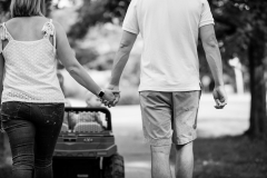 East Grand Rapids couple holds hands on a family walk during a documentary photo session