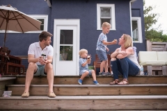 During a Grand Rapids documentary family photography session a boy shares his cupcake with his mother