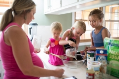 Family documentary session image of a Grand Rapids family making chocolate chip cookies