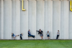 Family members strike poses for a creative family portrait in Grand Rapids