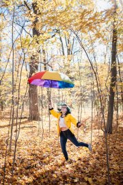 Creative and artistic senior portrait of a girl in fall Grand Rapids area woods