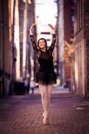 Ballerina poses for photo in an urban Grand Rapids senior portrait