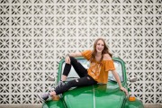 Grand Rapids senior portrait photographers photo of laughing girl on a green car