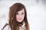 Senior portrait of a girl in a snowy West Michigan field