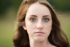 Senior photo close up of green eyed girl captured by Grand Rapids photographer