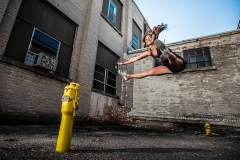 Grand Rapids cheerleader leaps in a dramatic Grand Rapids senior portrait