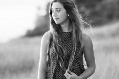 Grand Rapids senior portrait of a girl standing in dune grass on a Lake Michigan beach