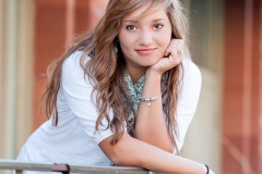 Senior girl poses for senior portraits in downtown Grand Rapids