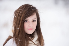 Senior portrait of a girl in a snowy West Michigan field