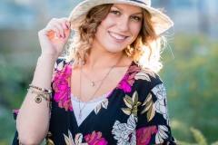 Senior girl is backlit in a natural West Michigan portrait