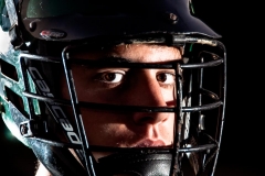 Senior lacrosse player portrait of a boy in Grand Rapids