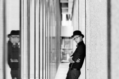 Artistic creative portrait of senior guy in urban Grand Rapids