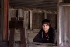 Senior boy poses for downtown Grand Rapids senior pictures