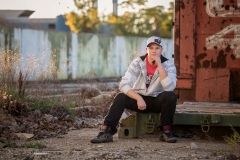 Gritty urban male senior portraits of a boy in Grand Rapids