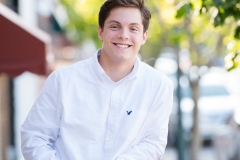 Senior guy smiles for a male high school senior portrait in Grand Rapids Michigan