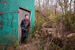 Senior boy poses for male high school senior portraits in Grand Rapids Michigan