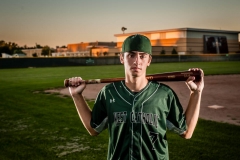 Baseball player boy poses for a male senior portraits in Grand Rapids