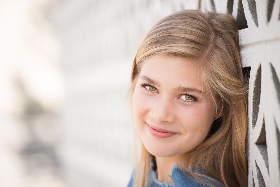 Grand Rapids senior girl smiles beautifully in a close up during her senior portraits